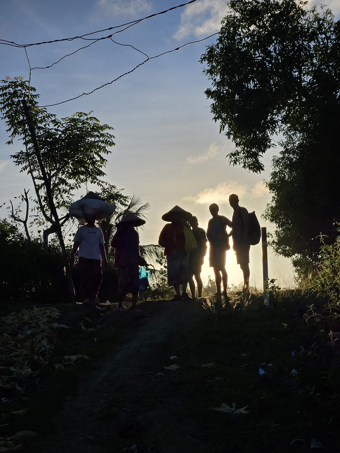 Sasak walkers at sunrise